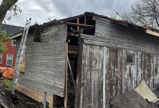 Detached garage stripped down during a full roof rebuild
