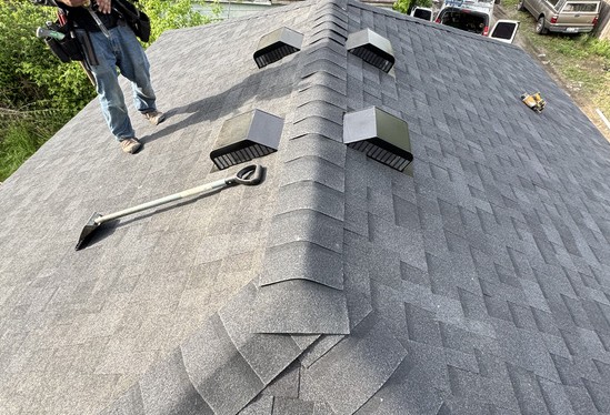 Newly shingled garage roof with box vents installed