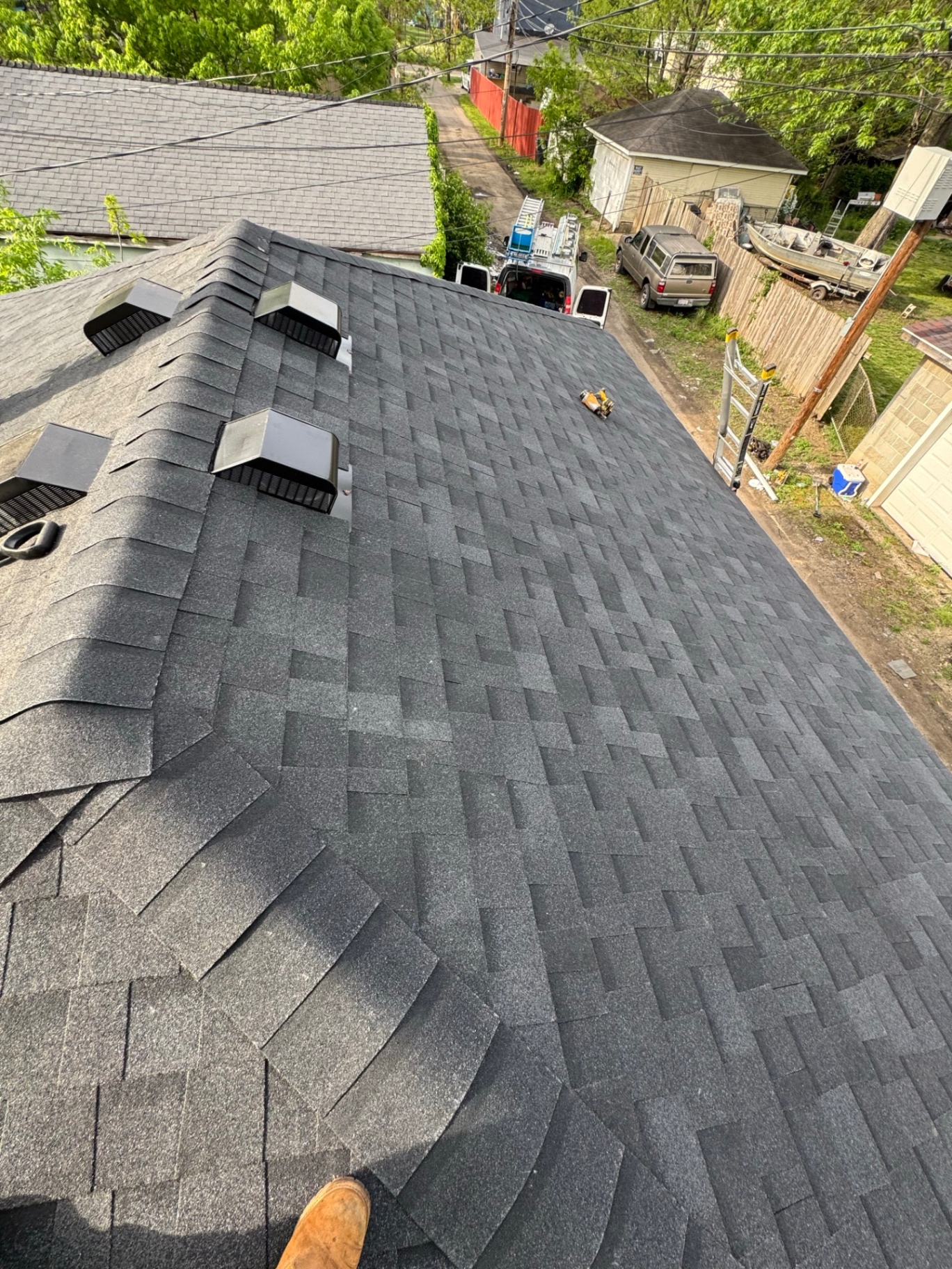 Crew installing — Shingle install in progress