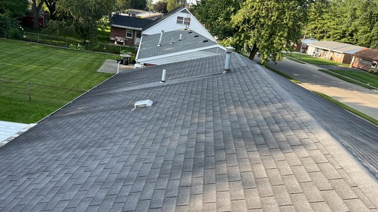 Aerial view down a completed architectural shingle roof