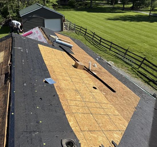 Roof deck patched with new plywood before shingles are installed
